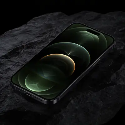 Smartphone glowing on a dark stone surface